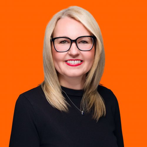 Professional business consultant headshot showing an approachable and confident expert.