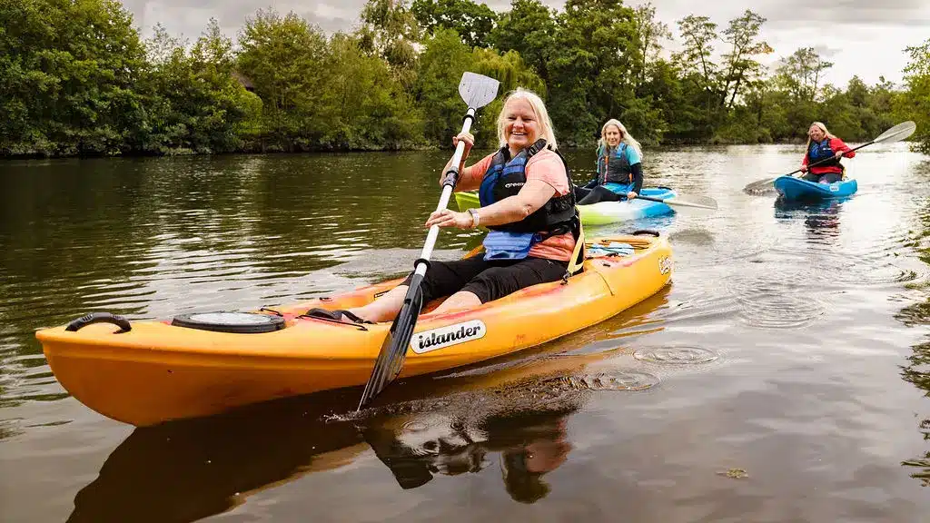 Personal branding photography Chester — lifestyle kayaking shoot on the River Dee at Eccleston Ferry, showing personality behind the brand